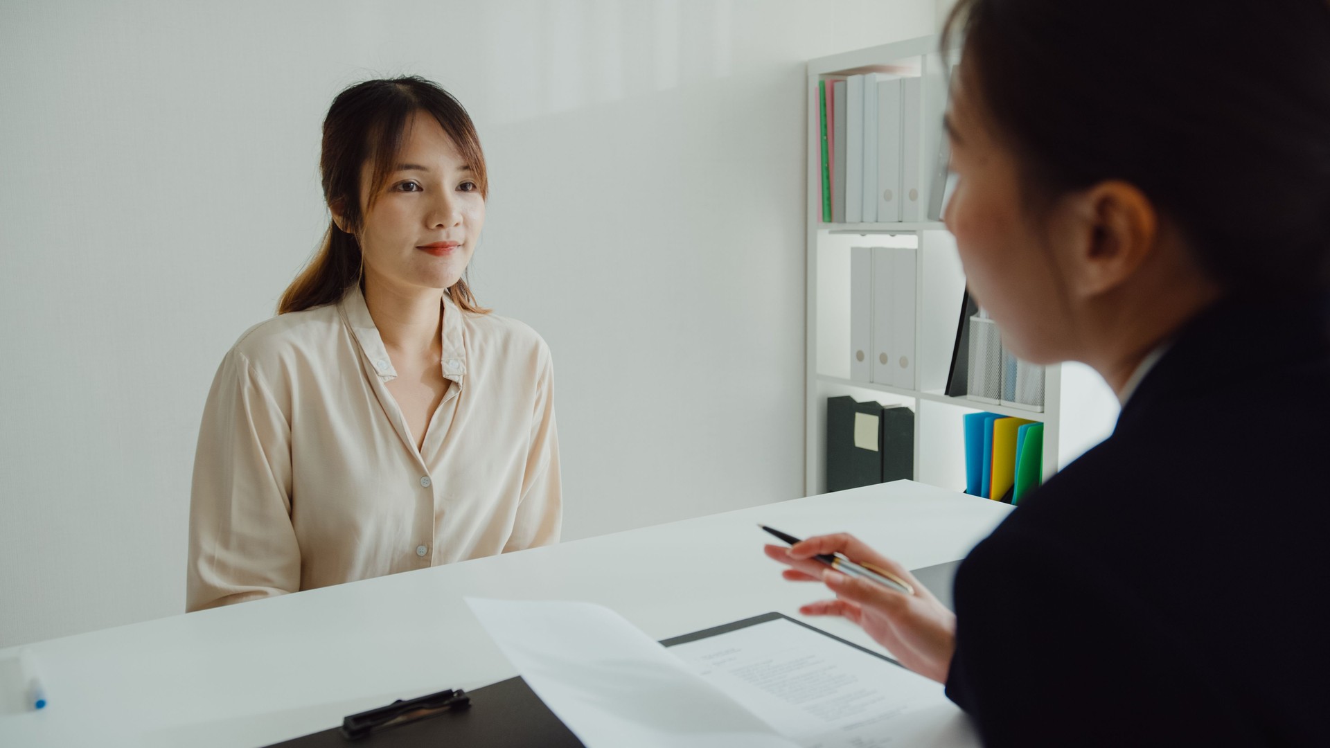 Young Asian woman pass job interview sit in front of HR manager at office. Human resource, Recruitment agency.